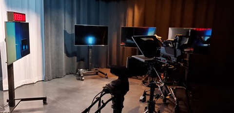 Photo of empty studio setup with TVs and Cameras